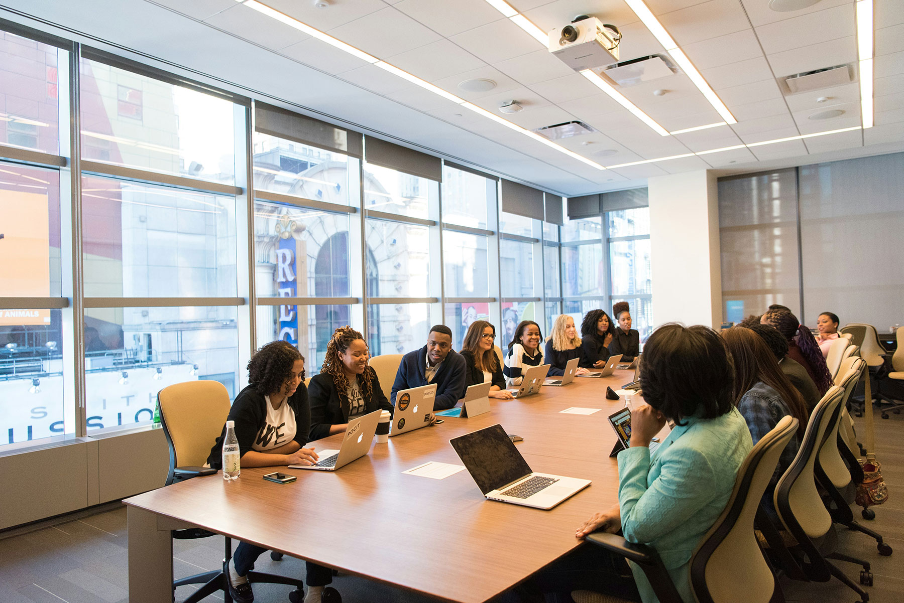 Multiple workers at a meeting in a conference room